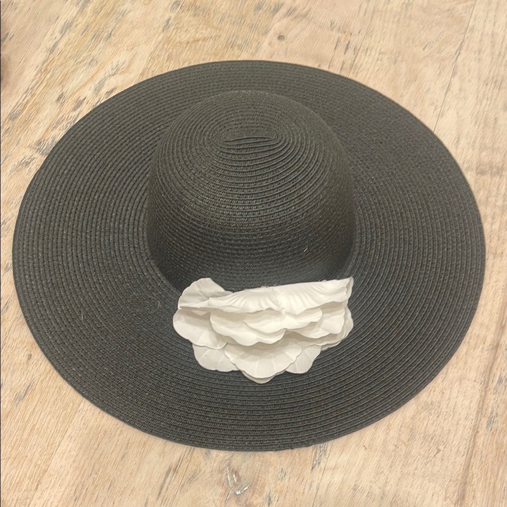 Elegant Black Wide-Brim Hat with White Floral Accent
